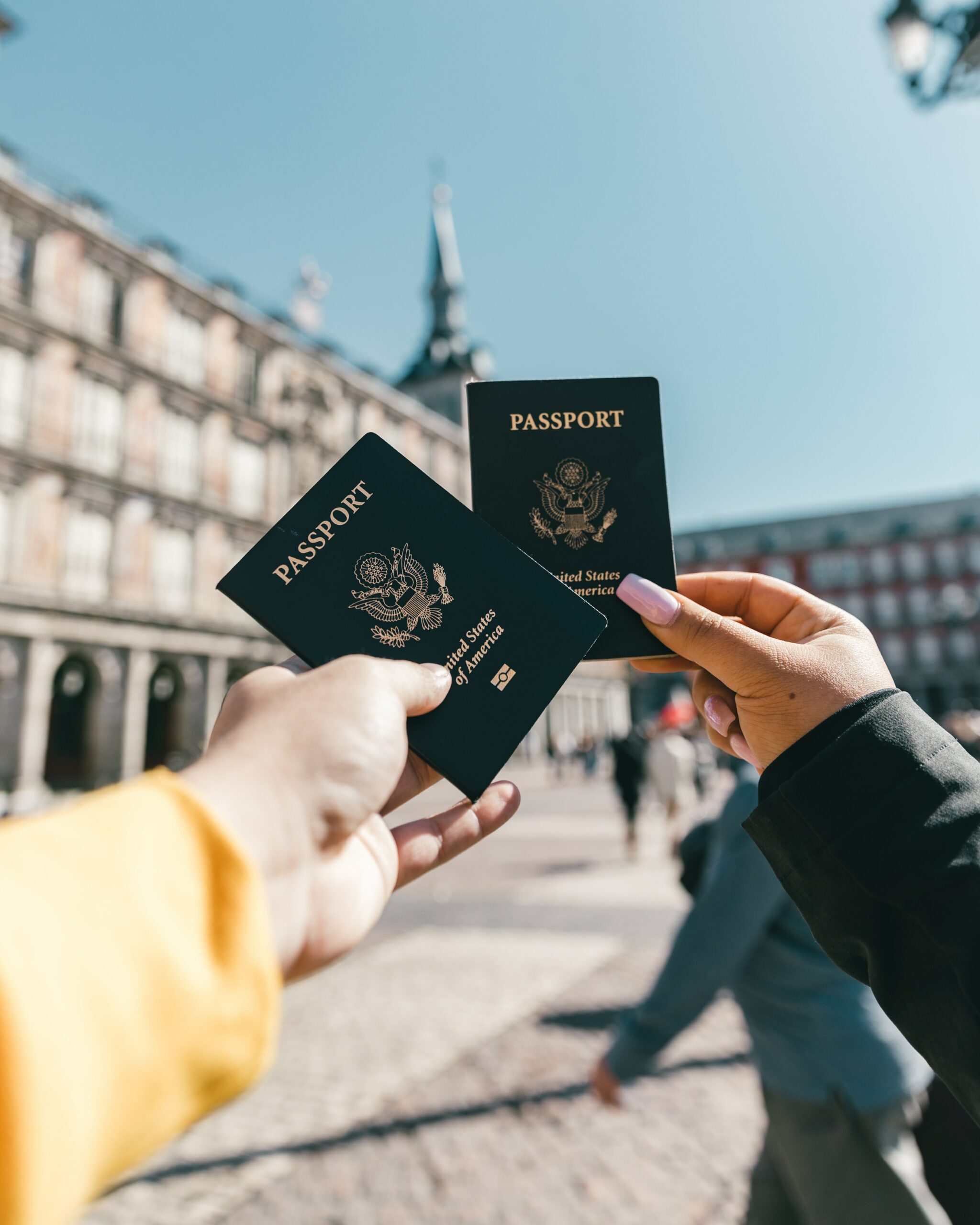 Visitors holding their passports